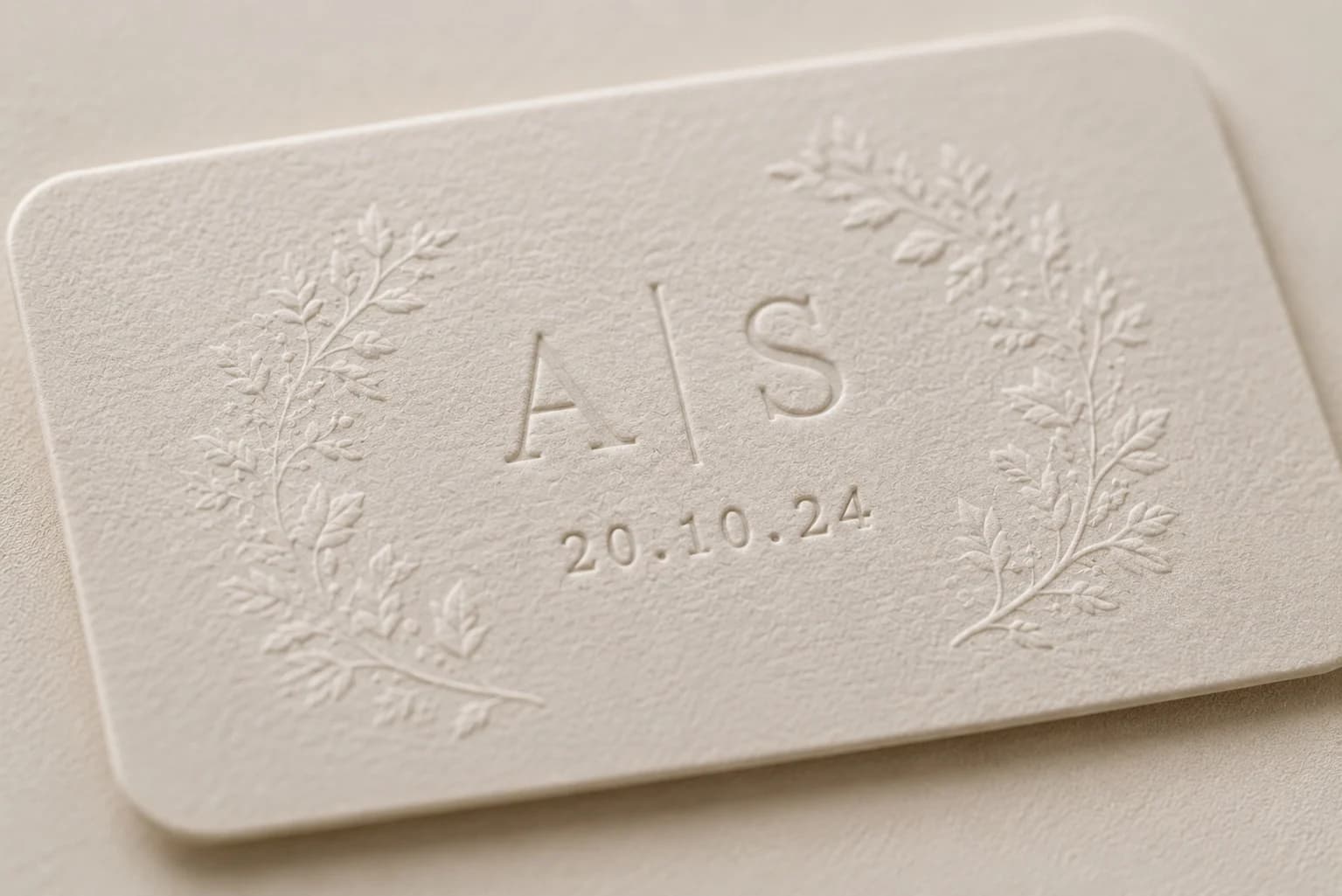 Debossed card with gold emblem detail