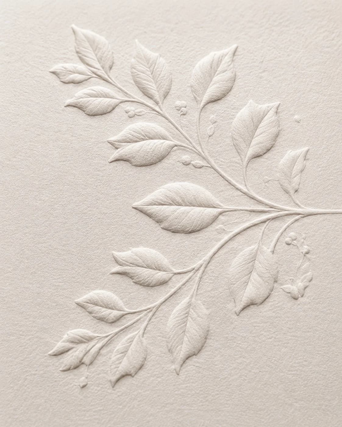 Embossed floral invitation stationery on linen