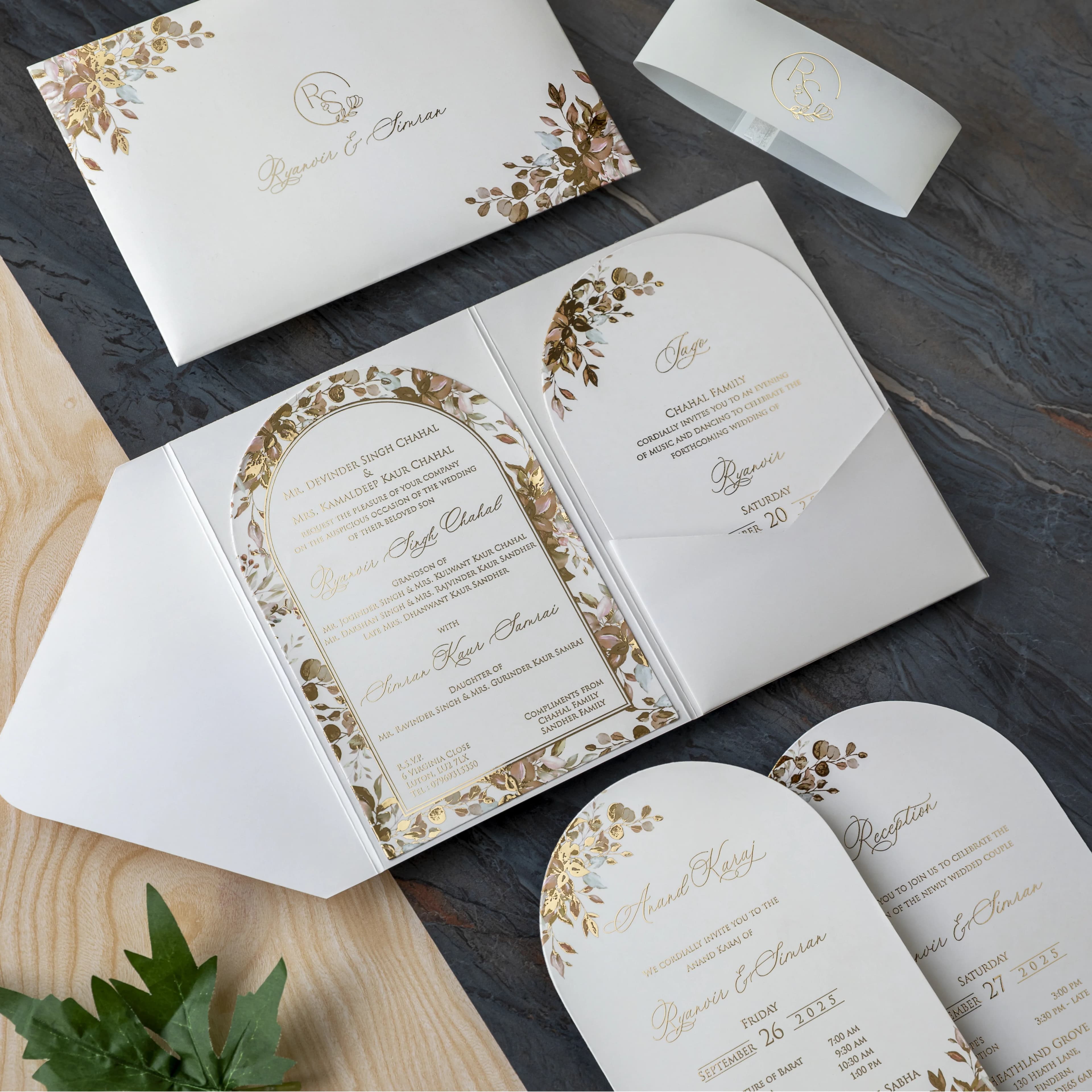 Wedding invitation suite with gold foil and floral detailing