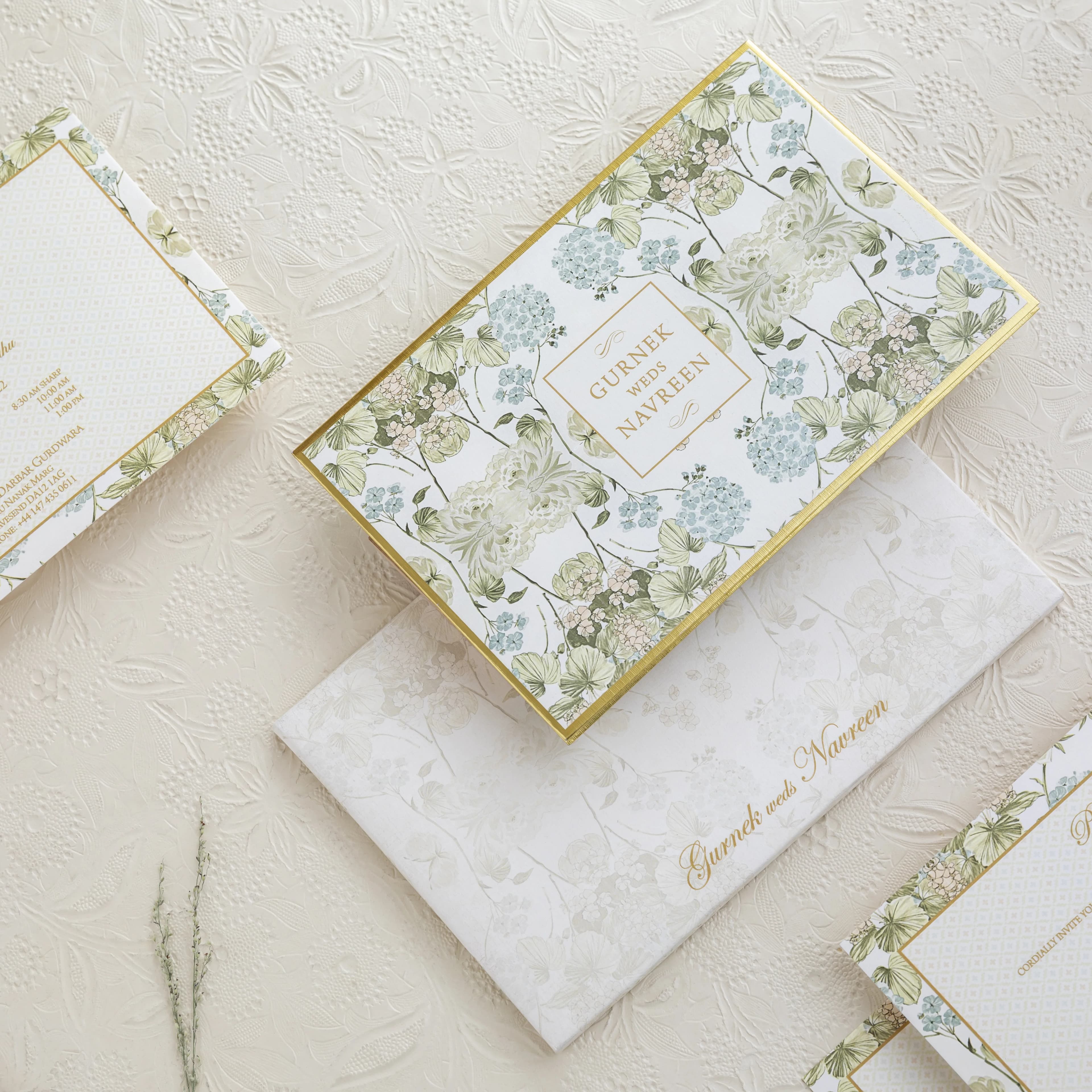 Candlelit celebration table with elegant menu cards, greenery and warm ambient light